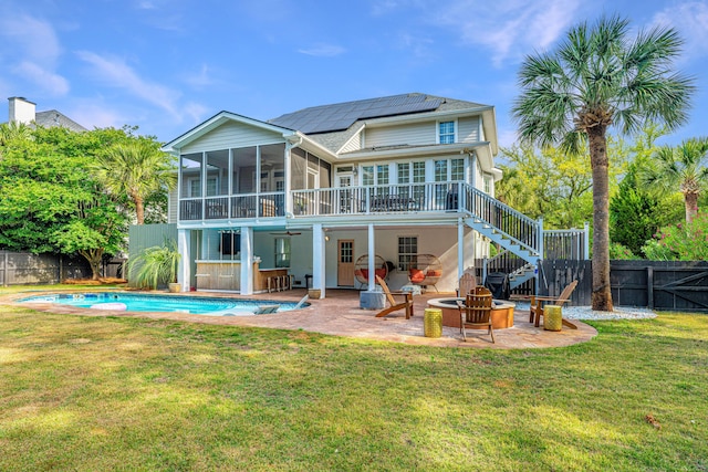 1143 Sea Eagle Watch, Charleston, SC 29412 - rear view of property with a sunroom, a patio area, a ceiling fan, a fenced backyard, and roof mounted solar panels