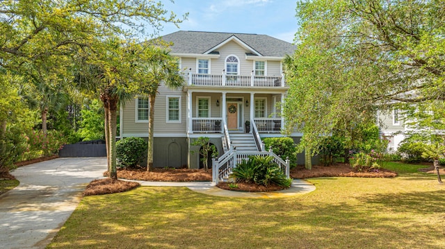 1143 Sea Eagle Watch, Charleston, SC 29412 - view of front facade featuring stairway, covered porch, a front yard, driveway, and a shingled roof