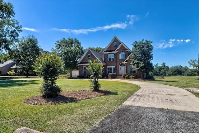 craftsman inspired home with a front yard