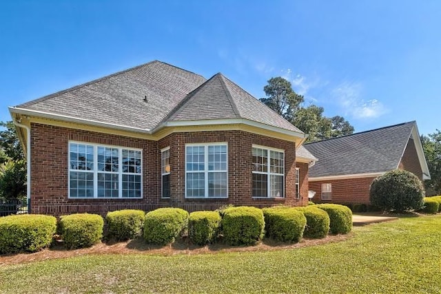 view of property exterior featuring a yard