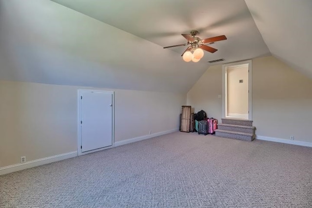 bonus room with light carpet, ceiling fan, and vaulted ceiling