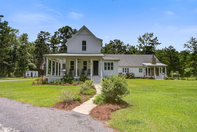 105 Bobcat Ln, Ravenel, SC 29470 - modern farmhouse featuring covered porch, a front yard, and a chimney