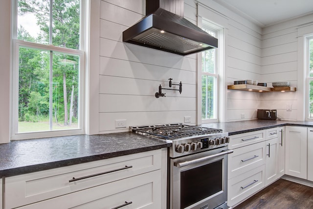 105 Bobcat Ln, Ravenel, SC 29470 - kitchen with custom exhaust hood, high end stove, white cabinetry, and dark wood finished floors