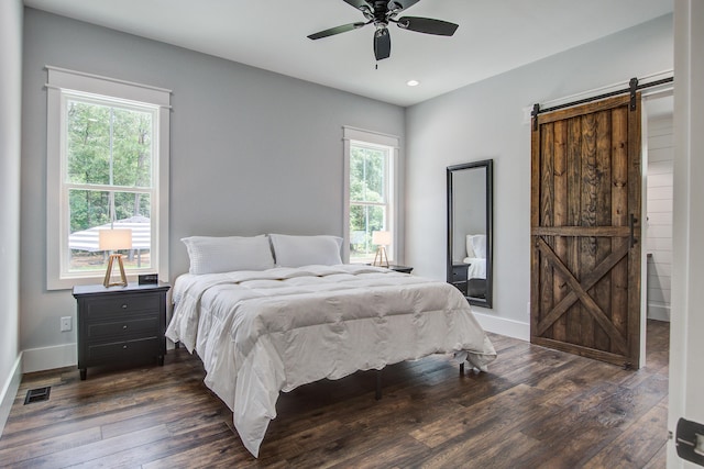 105 Bobcat Ln, Ravenel, SC 29470 - bedroom with a barn door, dark wood-style flooring, recessed lighting, baseboards, and a ceiling fan