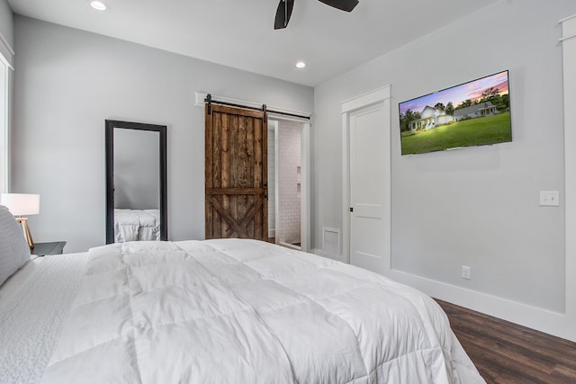 105 Bobcat Ln, Ravenel, SC 29470 - bedroom featuring a barn door, wood finished floors, recessed lighting, baseboards, and ceiling fan