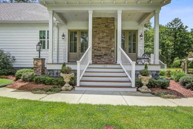 105 Bobcat Ln, Ravenel, SC 29470 - entrance to property featuring a porch, a shingled roof, and french doors