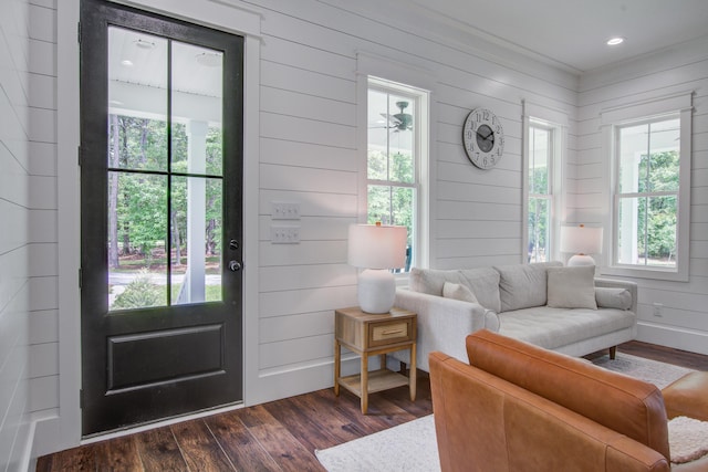 105 Bobcat Ln, Ravenel, SC 29470 - living area featuring dark wood-type flooring and wooden walls