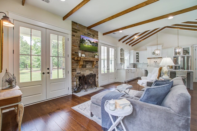 105 Bobcat Ln, Ravenel, SC 29470 - living room featuring french doors, dark wood-style floors, and a stone fireplace