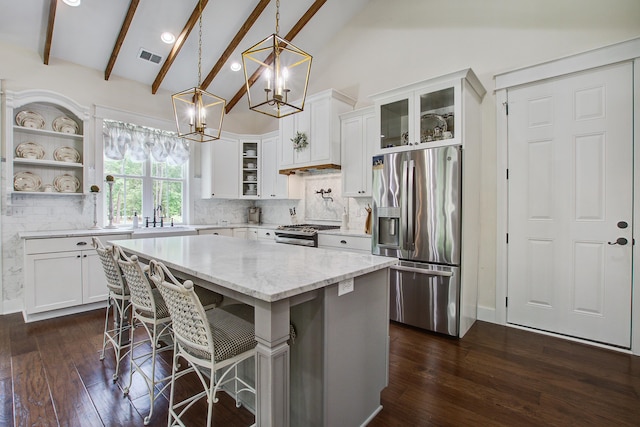 105 Bobcat Ln, Ravenel, SC 29470 - kitchen featuring appliances with stainless steel finishes, a sink, dark wood-style flooring, white cabinets, and recessed lighting