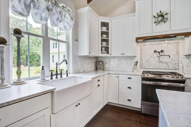 105 Bobcat Ln, Ravenel, SC 29470 - kitchen featuring gas stove, a sink, and white cabinets