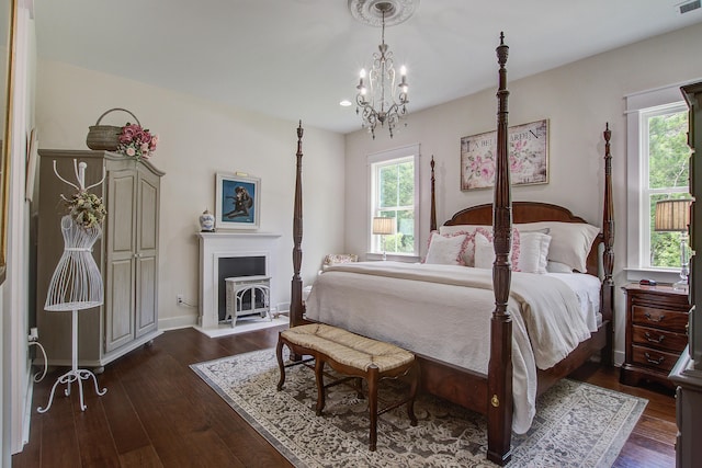 105 Bobcat Ln, Ravenel, SC 29470 - bedroom with multiple windows, dark wood-style flooring, a chandelier, and recessed lighting