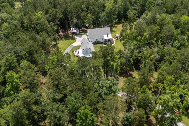 105 Bobcat Ln, Ravenel, SC 29470 - aerial view of property and surrounding area featuring a heavily wooded area