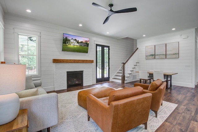 105 Bobcat Ln, Ravenel, SC 29470 - living room featuring a ceiling fan, wooden walls, stairs, wood finished floors, and ornamental molding