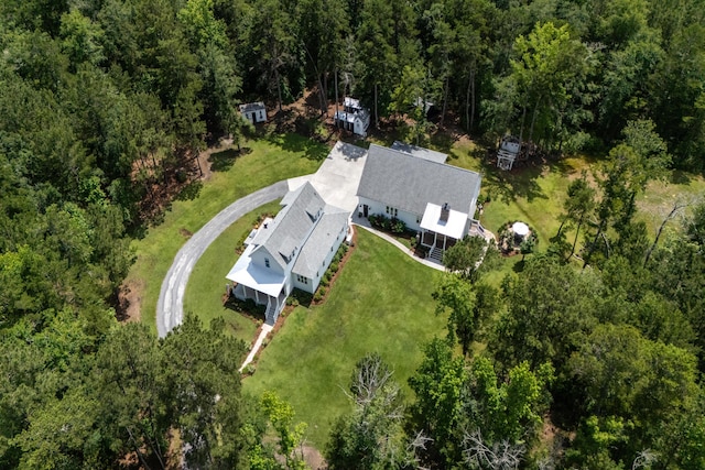 105 Bobcat Ln, Ravenel, SC 29470 - aerial view of property and surrounding area featuring a heavily wooded area
