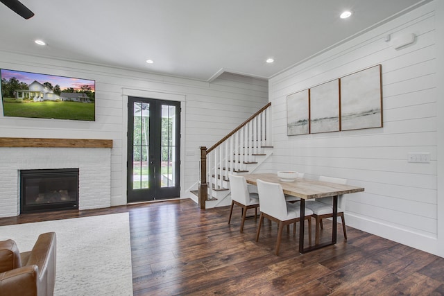 105 Bobcat Ln, Ravenel, SC 29470 - dining space featuring stairs, ornamental molding, wood-type flooring, french doors, and wooden walls