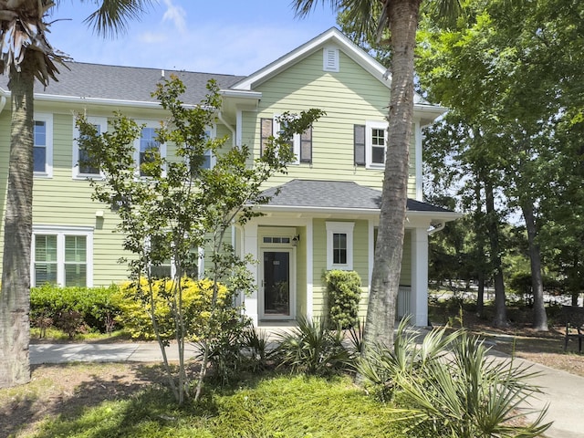 view of front of home with a shingled roof