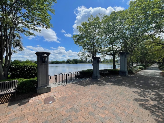 view of patio with a water view