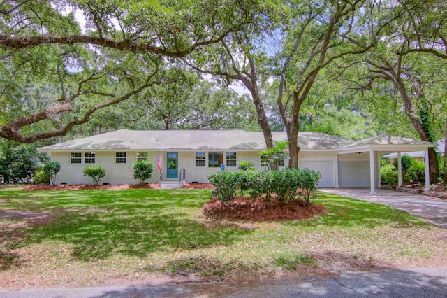 single story home with a garage, a front lawn, and a carport