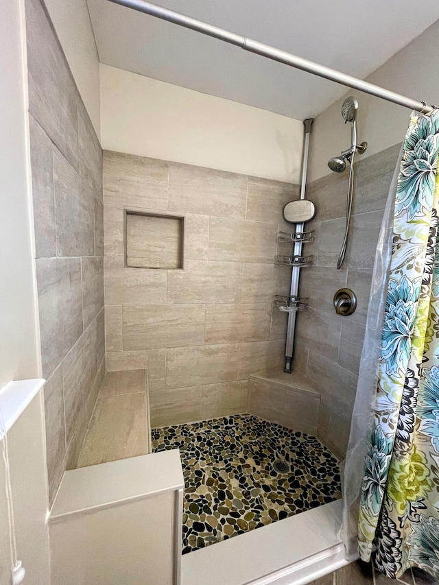 bathroom with a shower with curtain