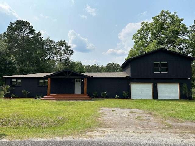 1211 Lem Rd, Cordesville, SC 29434 - view of front of home with a front lawn, driveway, and an attached garage