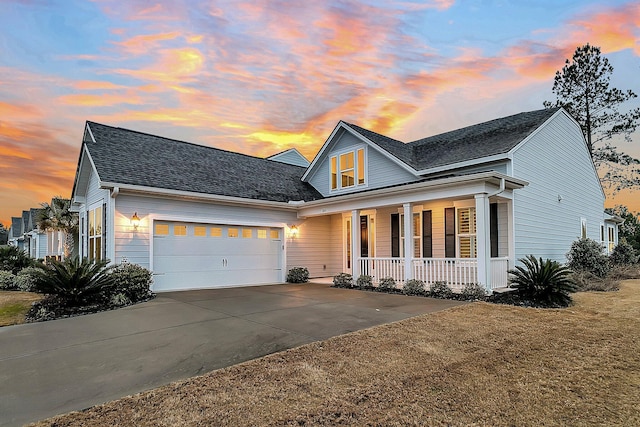 view of front of home featuring a garage and a porch