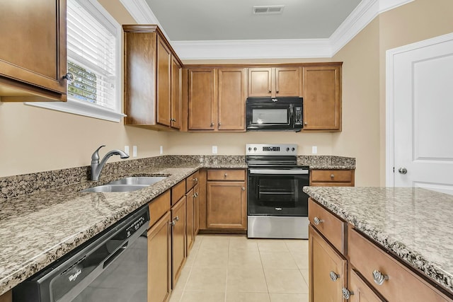 kitchen with visible vents, electric range, a sink, black microwave, and dishwasher