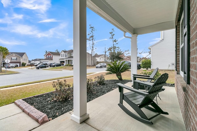 view of patio / terrace featuring a residential view and a porch