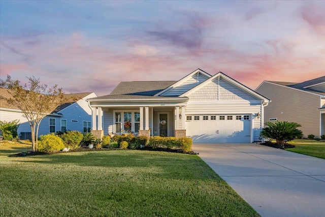 550 Tidewater Chase Ln, Summerville, SC 29486 - view of front of property featuring a garage, covered porch, and a lawn