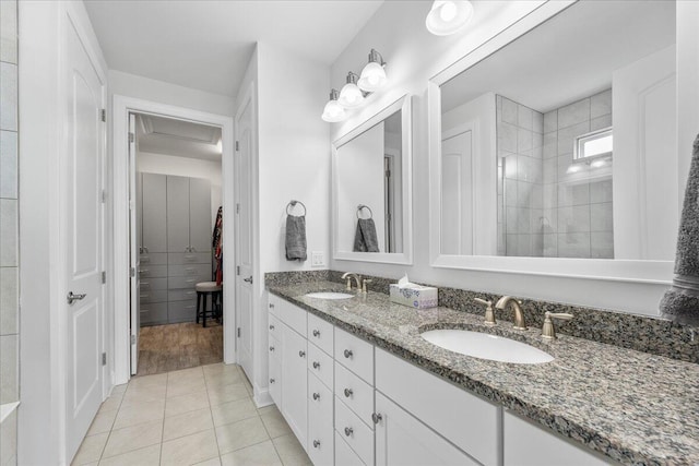 bathroom with tile patterned floors and vanity