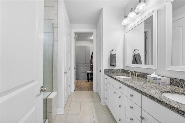 bathroom with tile patterned flooring and vanity