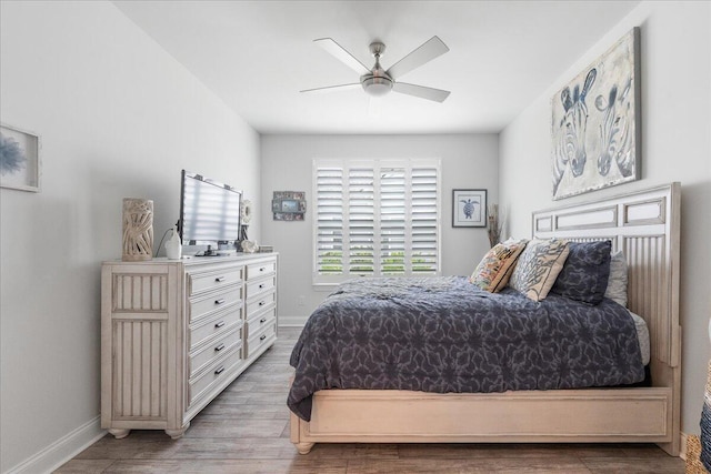 bedroom featuring ceiling fan and light wood-type flooring