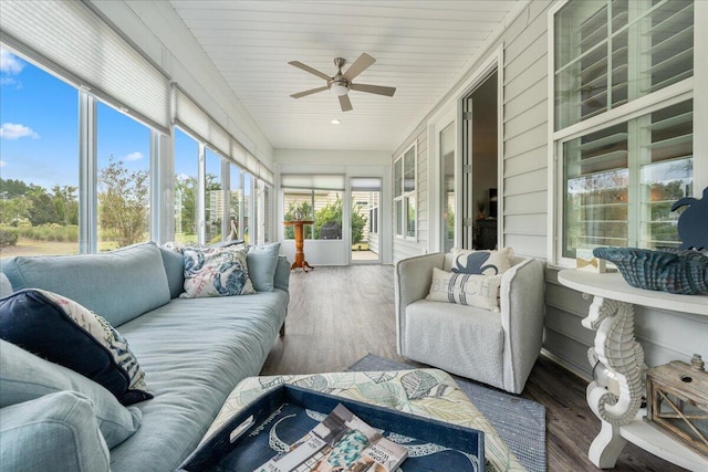 sunroom featuring wood ceiling and ceiling fan