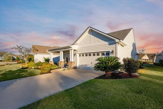 craftsman-style house with a garage and a yard