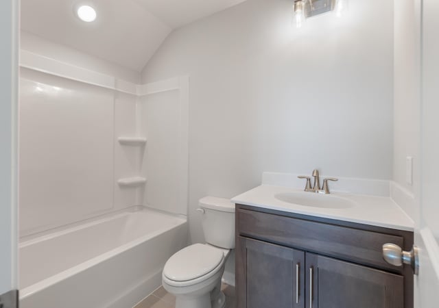 bathroom with vanity, tile patterned flooring, vaulted ceiling, bathing tub / shower combination, and toilet