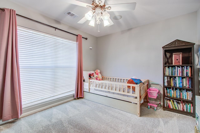 486 Maple Oak Ln, Charleston, SC 29414 - carpeted bedroom with a nursery area, baseboards, and ceiling fan