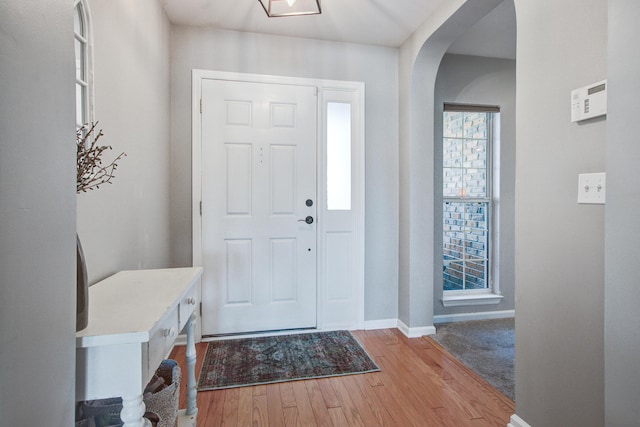 486 Maple Oak Ln, Charleston, SC 29414 - foyer entrance featuring arched walkways, wood finished floors, and baseboards