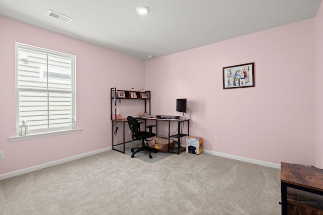 carpeted office with baseboards