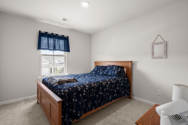 carpeted bedroom with baseboards