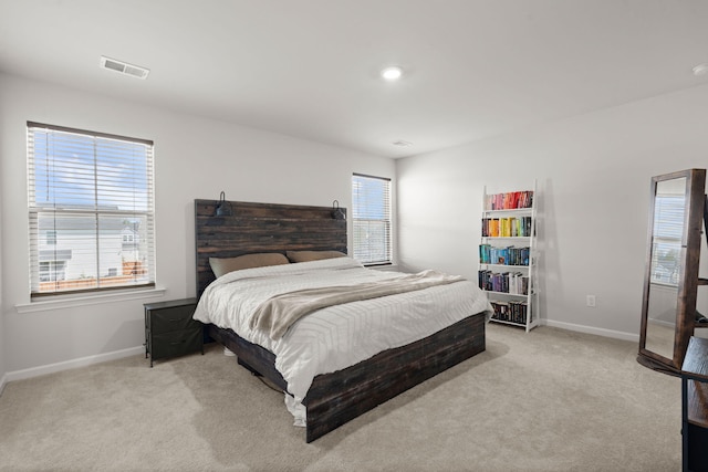 carpeted bedroom featuring baseboards