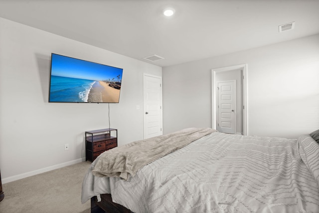 carpeted bedroom featuring baseboards and recessed lighting