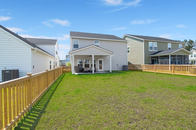 rear view of house featuring a sunroom, cooling unit, ceiling fan, and a patio area