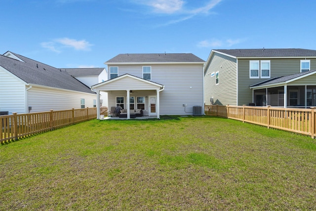 back of house with a patio, a sunroom, and cooling unit