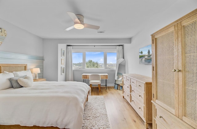 bedroom featuring light wood finished floors and a ceiling fan