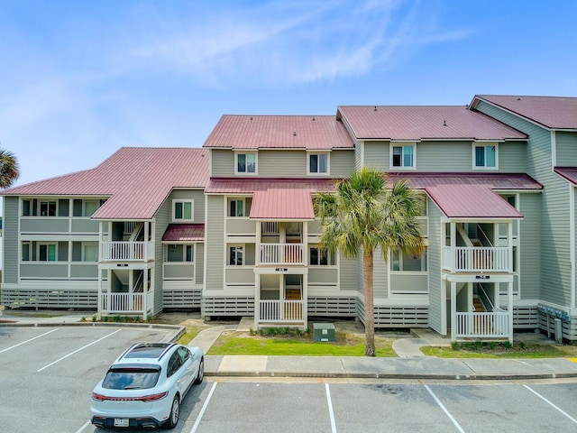 view of property with uncovered parking
