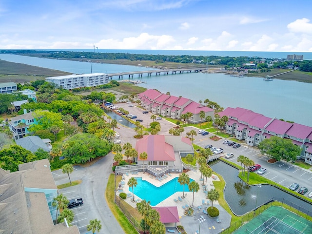 aerial view of a large body of water, a pool, and a notable bridge