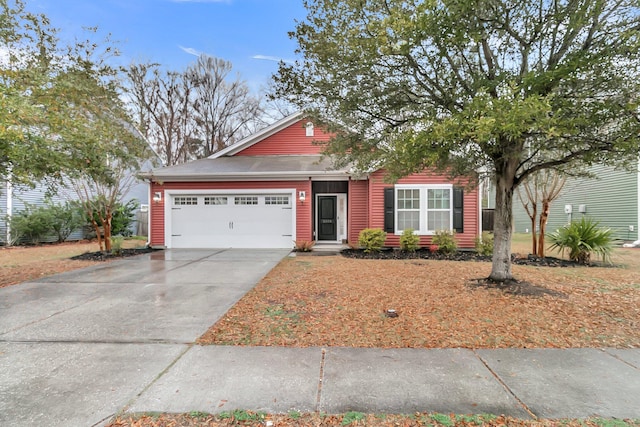 view of front of home featuring driveway and an attached garage