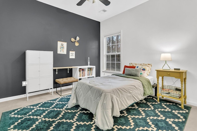 bedroom featuring ceiling fan, carpet flooring, visible vents, and baseboards