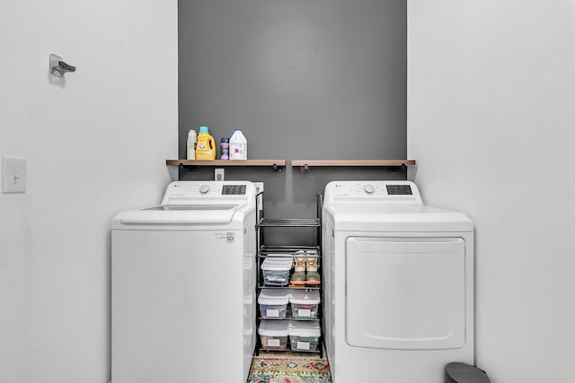 clothes washing area with laundry area and independent washer and dryer