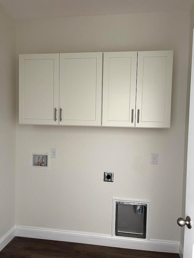 clothes washing area featuring dark wood-type flooring, cabinets, electric dryer hookup, and hookup for a washing machine