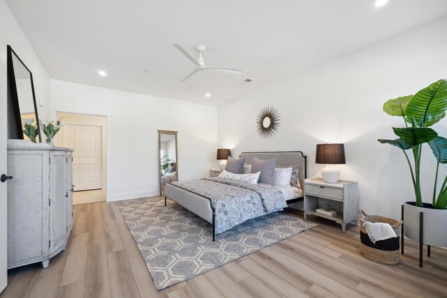 bedroom featuring ceiling fan and light hardwood / wood-style flooring